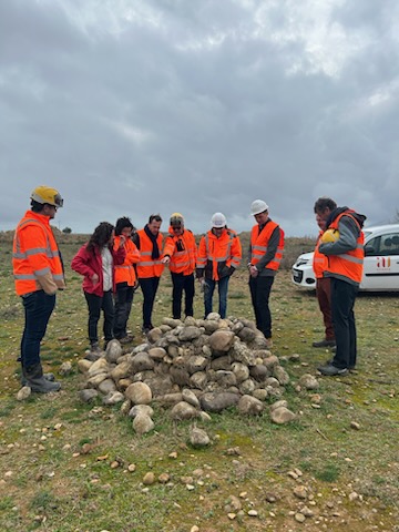 The group in front of an artificial shelter to encourage the recolonisation of the Ocellated Lizard on the site of the rehabilitated quarry Photo: Charlotte Gonin, parliamentary attaché.